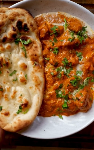 A plate of food with bread and sauce.