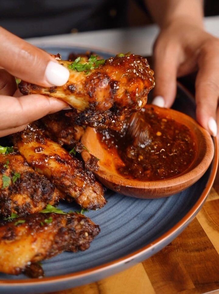 A person is dipping some food into it