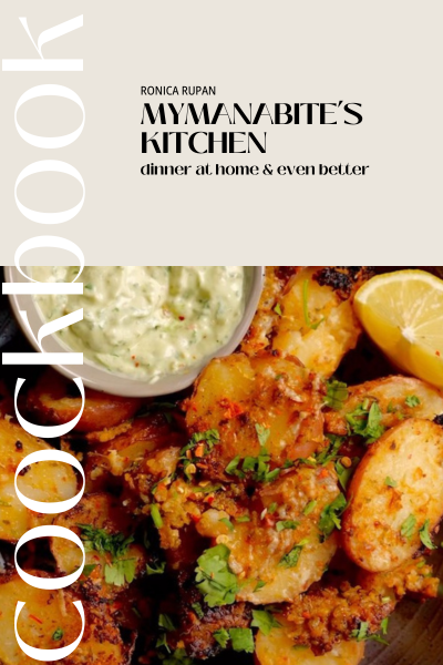 A cookbook cover with potatoes and sauce.