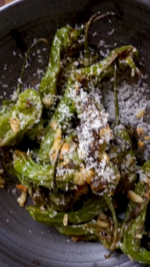 A close up of some food with parmesan cheese