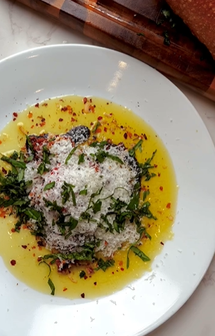 A plate of food with rice and herbs on it.