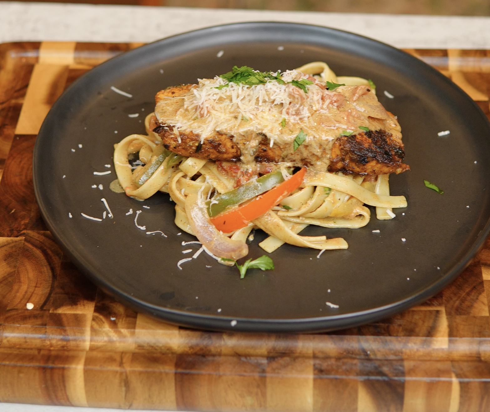 A plate of food on a wooden board.