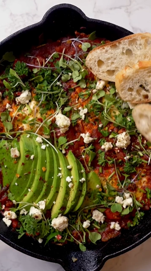 A close up of food with avocado and feta